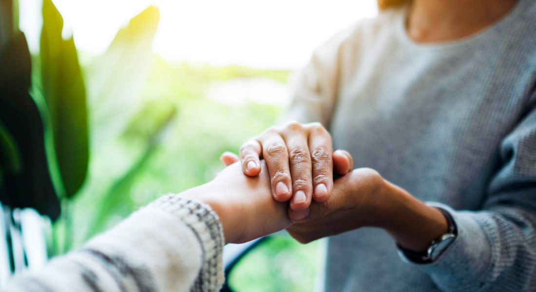two people holding hands